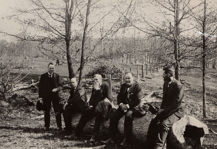 Calvin in 1898. He is the second person from the left